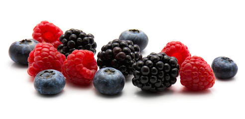 Berries isolated on white background blackberry blueberry and raspberry heap.