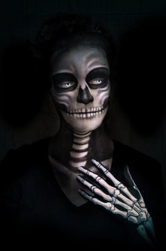 Halloween concept illustration. Makeup Girls image of a skeleton on a black background. Illustration in soft oil painting style.