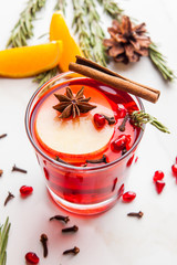 Christmas. Winter cocktail grog, hot sangria, mulled wine. On white marble table.