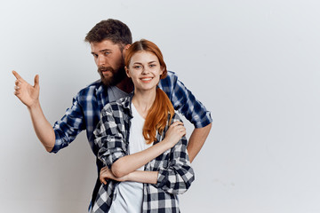 Young guy with beard and beautiful woman on white isolated background, repair, housework