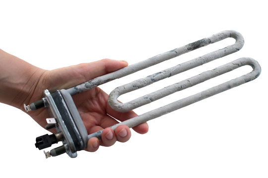 Hand holding washing machine heater with scum on a white background