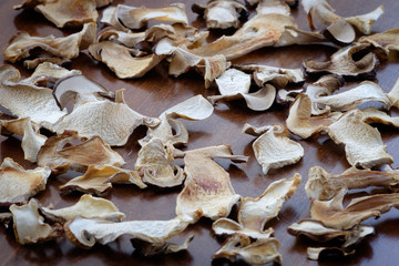 Dried boletus mushroom slices food background texture