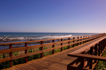 Fototapeta premium Beach. Wooden road in the beach. Costa del Sol, Andalusia, Spain.