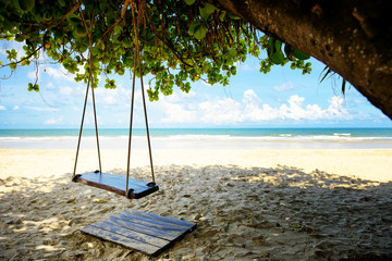 Swing hang on a tree beside the beach in Thailand
