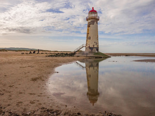 Lighthouse on Talacre Beach at low tide, Talacre, North Wales, UK