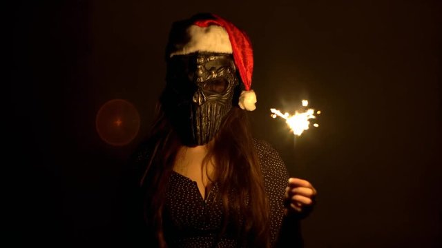 4K Serial Christmas Girl Killer With Mask Portrait Holding Sparklers Slow Motion