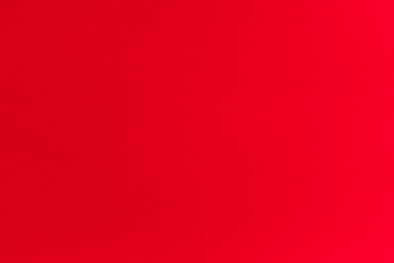 Abstract red background color is Christmas paper made from corrugated have texture not smooth when zoom in the background. It will be suitable for use at festival the end of the year or in new year.