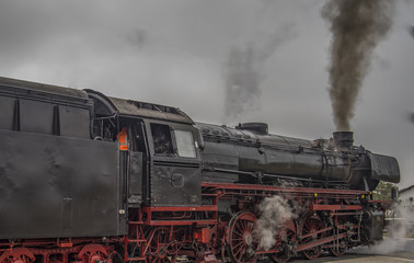 Obraz na płótnie Canvas vintage black steam powered railway train