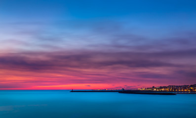 Fototapeta na wymiar Red sunset over Porto - Bico do Cabedelo. Taken in Vila Nova de Gaia, Porto, Portugal.