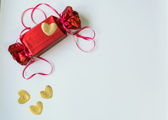 Valentine's Day. Red box with a bow and ribbons.