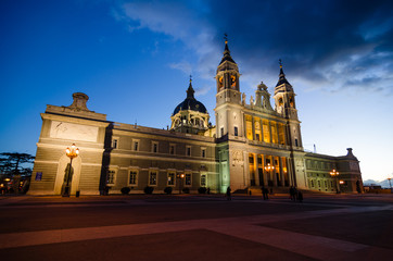 Fototapeta na wymiar Front view of Catedral de la Almudena in Madrid (Spain) during the blue hour. Illuminated at night.