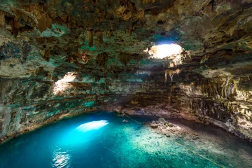 Gordijnen Cenote Samula Dzitnup near Valladolid, Yucatan, Mexico - swimming in crystal blue water © Simon Dannhauer