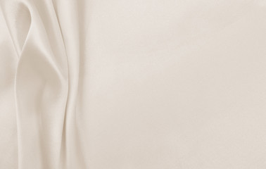 Smooth elegant golden silk or satin luxury cloth texture as wedding background. Luxurious...