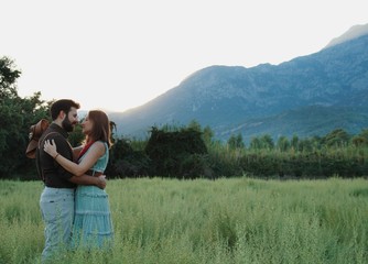 just married couple photo shoot romantic moments before kissing at sunset 