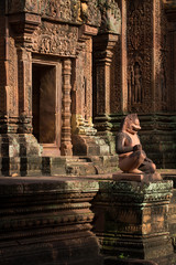 Intricate carvings around the stone doorway or a temple in Cambodia