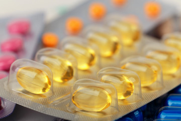 close-up of yellow medical pills in blister