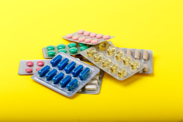 group of colored medical pills in blister. pharmacy or drugstore