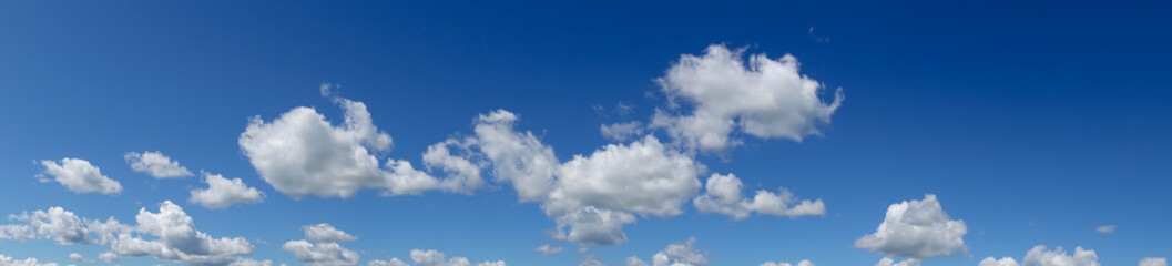 Obraz premium Panoramic blue sky with clouds. Panorama white clouds flying against blue sky.