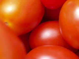 A few red tomatoes on the whole image.