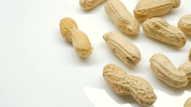 4k, Close-up studio shot footage of peanuts rotates in right side
