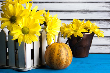 Bouquet of yellow daisies and pumpkin