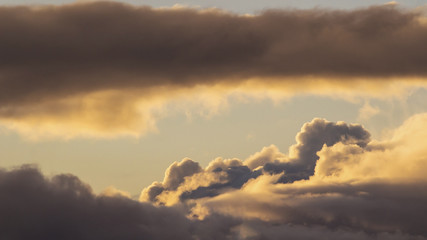 beautiful golden clouds in the setting sun