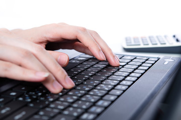 Hands typing on the keyboard