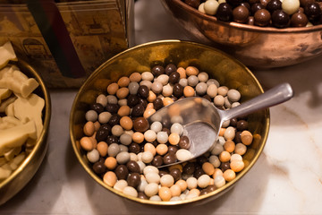 Belgium tasty truffle delicious chocolate in a row, candy shop view. Food travel tourism.