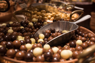 Belgium tasty truffle delicious chocolate in a row, candy shop view. Food travel tourism.