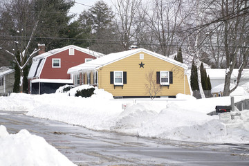 Colorful houses after snow storm in winter