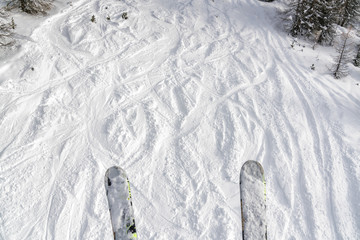 Ski and snowboard free ride tracks in fresh powder snow. POV vieved from the ski lift