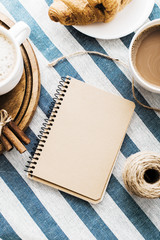 Obraz na płótnie Canvas Cappuccino on a striped tablecloth. Morning coffee.