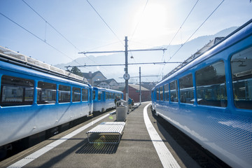 Fototapeta na wymiar Mt. Rigi, Switzerland - November 1, 2017: a Rigi Railways train leaving the Rigi-Kulm station . Rigi Railways (German: Rigi-Bahnen) is a group of railways on Mount Rigi.Switzerland