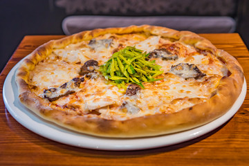 Very tasty pizza in a cafe restaurant