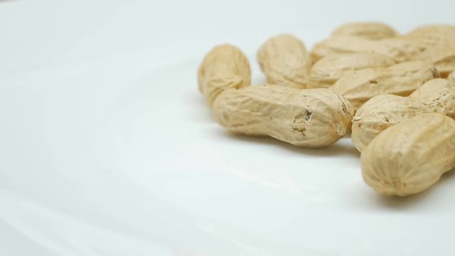 4k, Close-up studio shot footage of peanuts rotates in right side