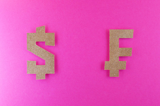 dollar and franc currency symbol on pink background