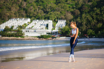 Girl on the beach. Fitness on the beach. Morning on the beach
