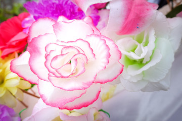 Fake flower and Floral background. rose flowers made of fabric. 