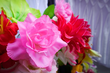 Fake flower and Floral background. rose flowers made of fabric. 