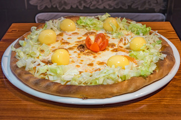 Very tasty pizza in a cafe restaurant