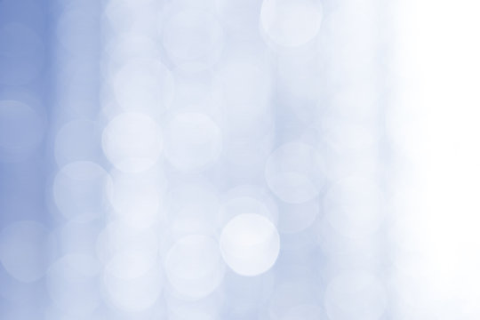 Abstract bokeh over blue blurred background