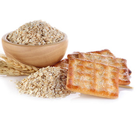 Barley ear and biscuits isolated on white background