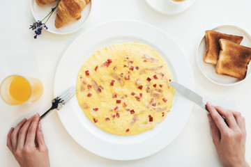 Close-up photo of of an omelette. Top view of the breakfast.