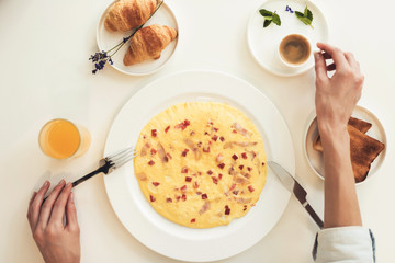 Close-up photo of of an omelette. Top view of the breakfast.