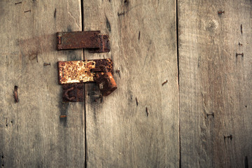 Old padlock on a wooden door