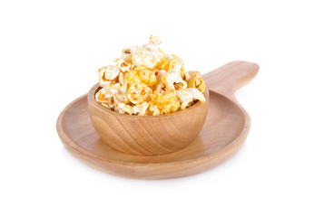 popcorn with butter flavors on wooden bowl with white background