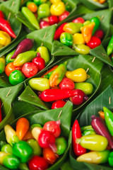 Thai Massapa'es ,Look Choup, Colorful deletable imitation fruits  in  banana leave container