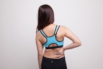 Naklejka premium Asian healthy girl got back pain.