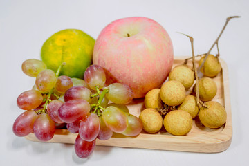 Close up of fruit on wooden tray