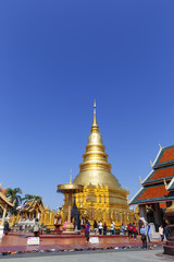 Golden Pagoda and hall in Wat Phra That Hariphunchai at Lamphun north of Thailand